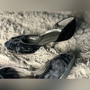 Black and silver Bebe stiletto heels